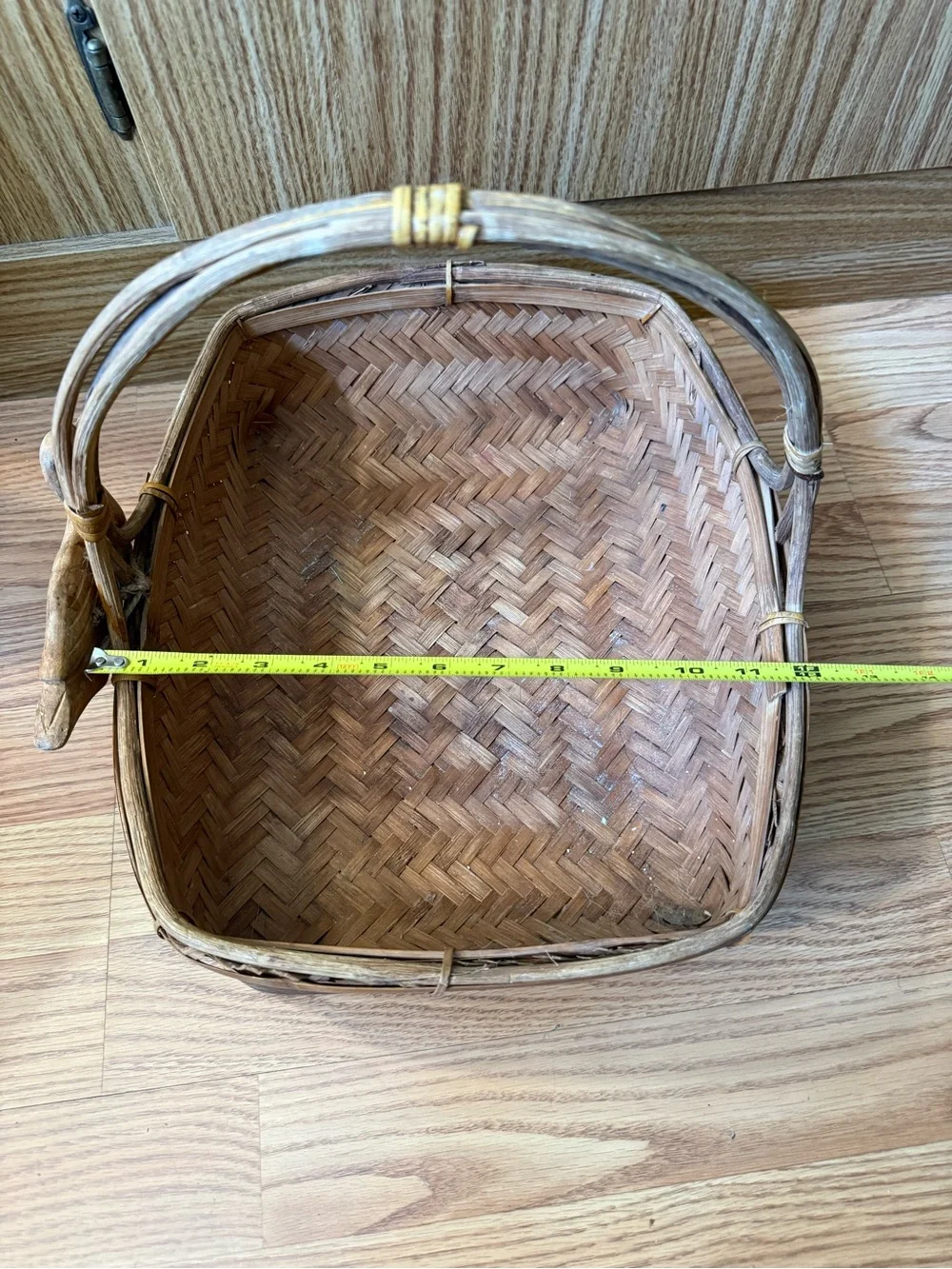 Vintage Zhejiang Chinese woven rattan and wood handled basket with a carved